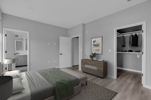 A bedroom with a bed, nightstand, and a wooden dresser.
