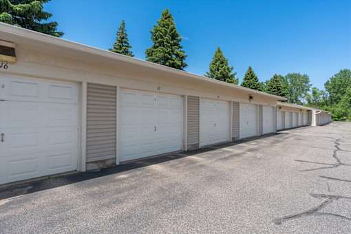 A row of garage doors are closed and shut.