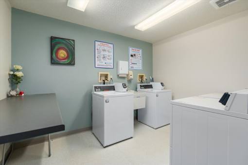 A medical office with two computers and a desk.