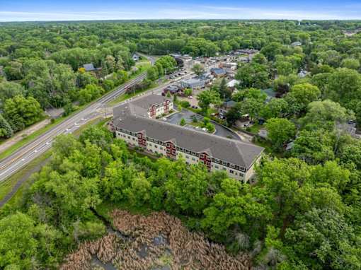 A bird's eye view of a town with a large building in the center.