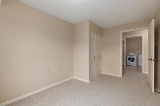 A room with a washer and dryer in it.