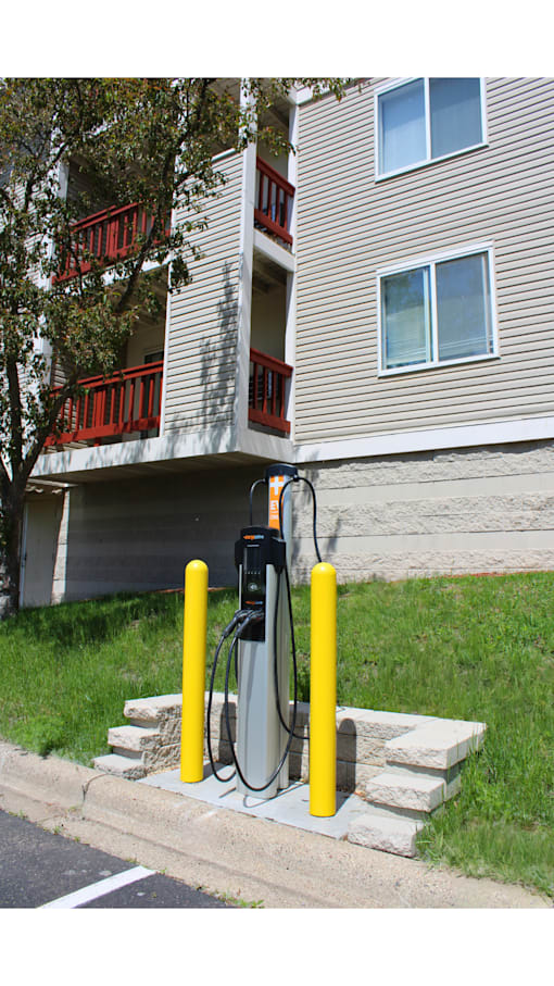 a gas pump on the side of a house