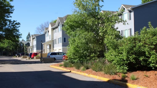 a row of houses on the side of a street