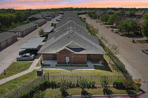 A residential area with houses and a church.