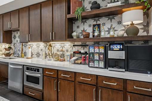 A kitchen with brown cabinets and a white countertop.