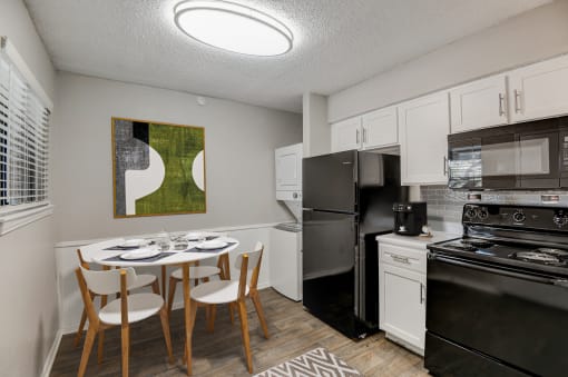 a kitchen and dining area in a 555 waverly unit