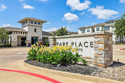 A sign that says Park Place in front of a building.