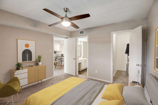 a bedroom with a bed and a ceiling fan
