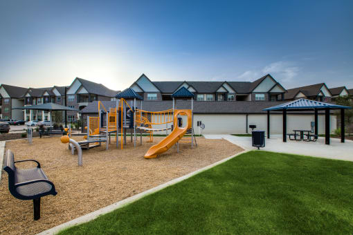 a playground at the whispering winds apartments in pearland, tx