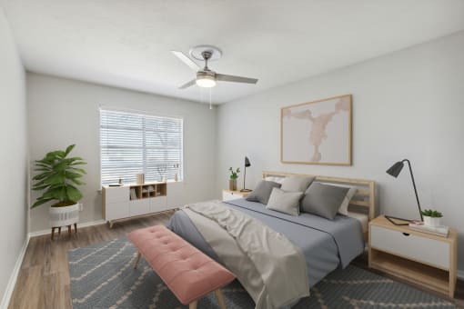 a bedroom with a bed and a ceiling fan
