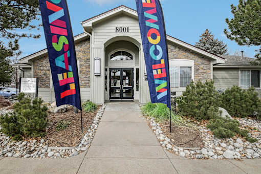 A building with a sign that says "Welcome" on it.