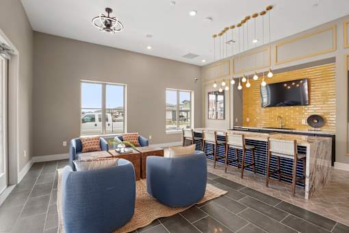 A modern living room with a bar area and a television.