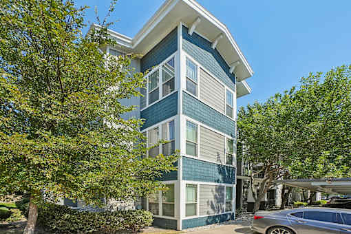 A modern two-story building with a blue and white exterior.