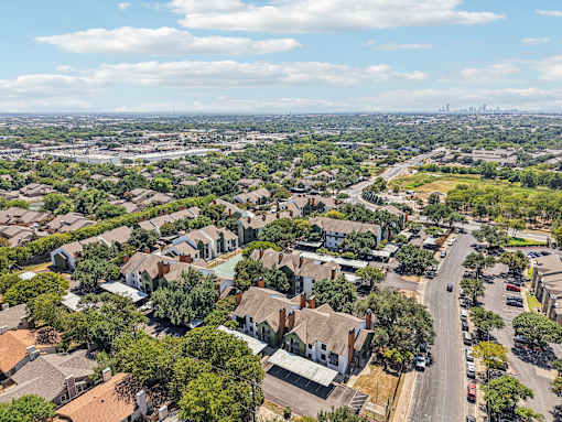 A suburban neighborhood with houses and trees.