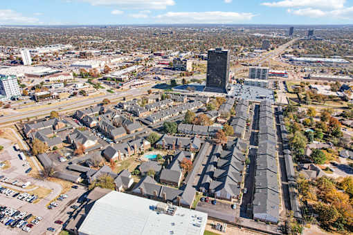 A cityscape with a mix of residential and commercial buildings.