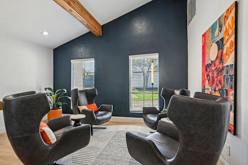 A room with black walls and a large painting on the wall.