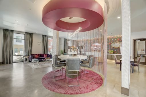 a dining area with a table and chairs in a lobby
