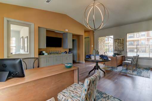 A living room with a wooden floor and a large window.