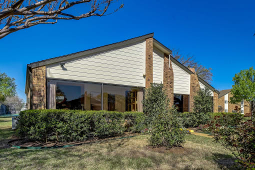 the front of a house with a yard in front of it