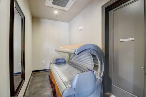 a patient room with an exam bed and an exam room door