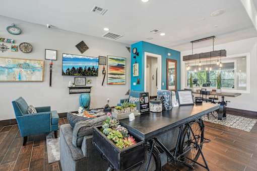 A blue chair sits in a room with a wooden floor.