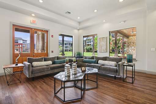 A living room with a grey couch and a coffee table.