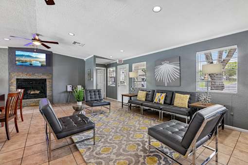 A living room with a fireplace and a television.