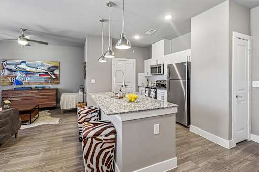 A kitchen with a zebra print bench in front of a counter.