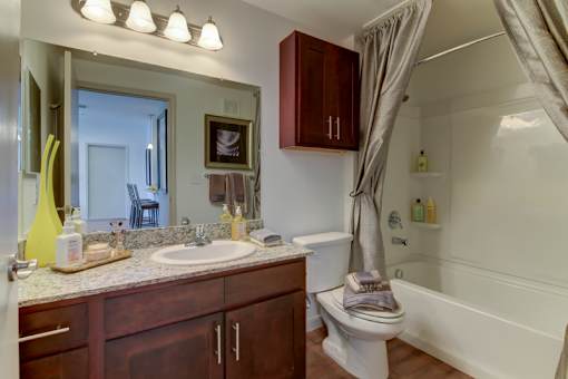 A bathroom with a white toilet and a white sink.