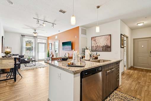 A kitchen with a dining table and chairs.
