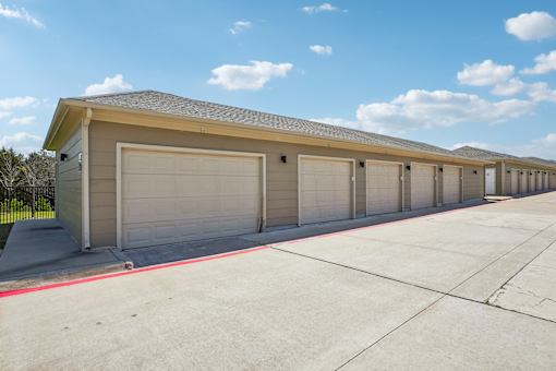 A long row of garage doors are closed.
