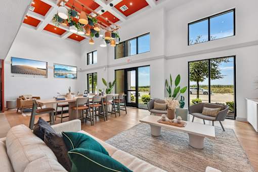 A modern living room with a large couch and a coffee table.