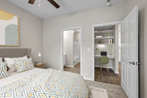 a bedroom with a large bed and a closet with a desk
