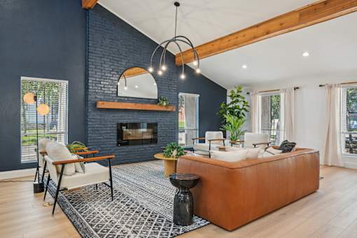 A living room with a fireplace and a large couch.