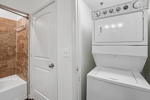 A white oven and stove top in a bathroom.