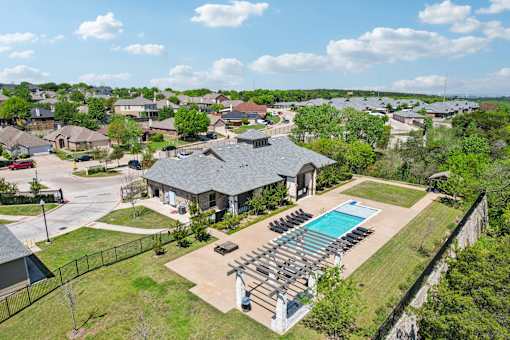 A large house with a pool in the backyard.