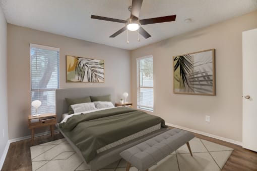 a bedroom with a bed and a ceiling fan