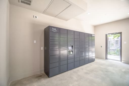 a row of lockers in a room with a door open
