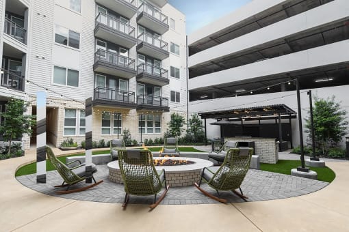 courtyard with fire pit and seating area at the district flats apartments
