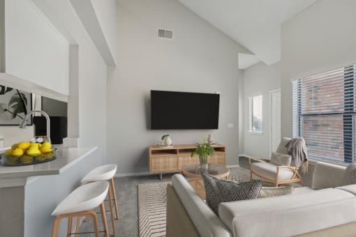 a living room with a couch and a table and a television