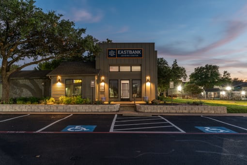 a rendering of the exterior of a building with a parking lot