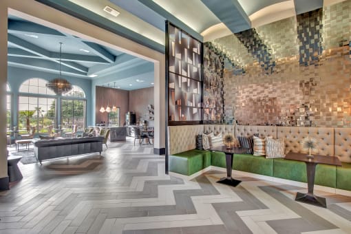a lobby with a brick wall and wood flooring