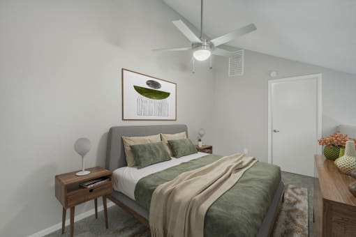 a bedroom with a large bed and a ceiling fan