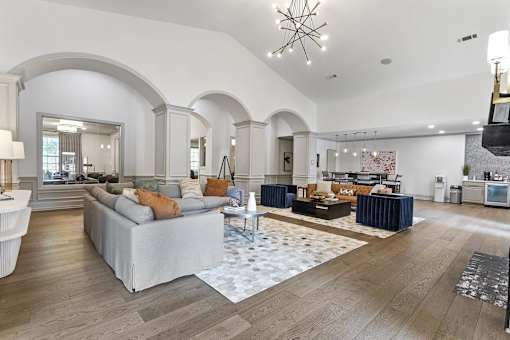 a living room with couches and a rug