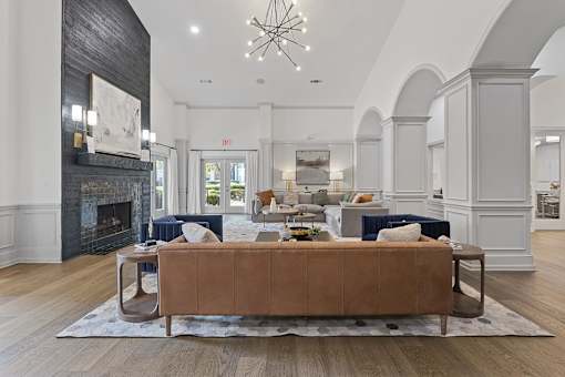 a living room with a couch and a fireplace