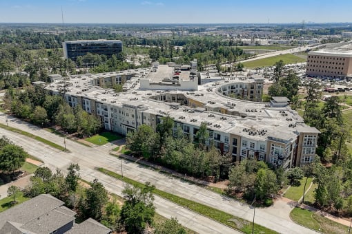 an aerial view of a city with buildings and trees