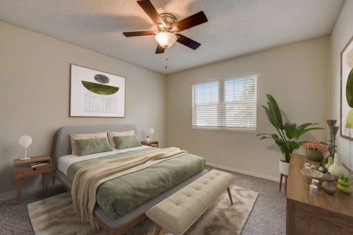 a bedroom with a bed and a ceiling fan