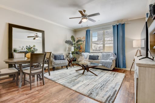 a living room with a couch and a dining room table
