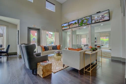 a living room with gray walls and a dark wood floor