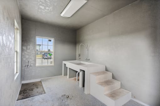 a bathroom with a sink and a window